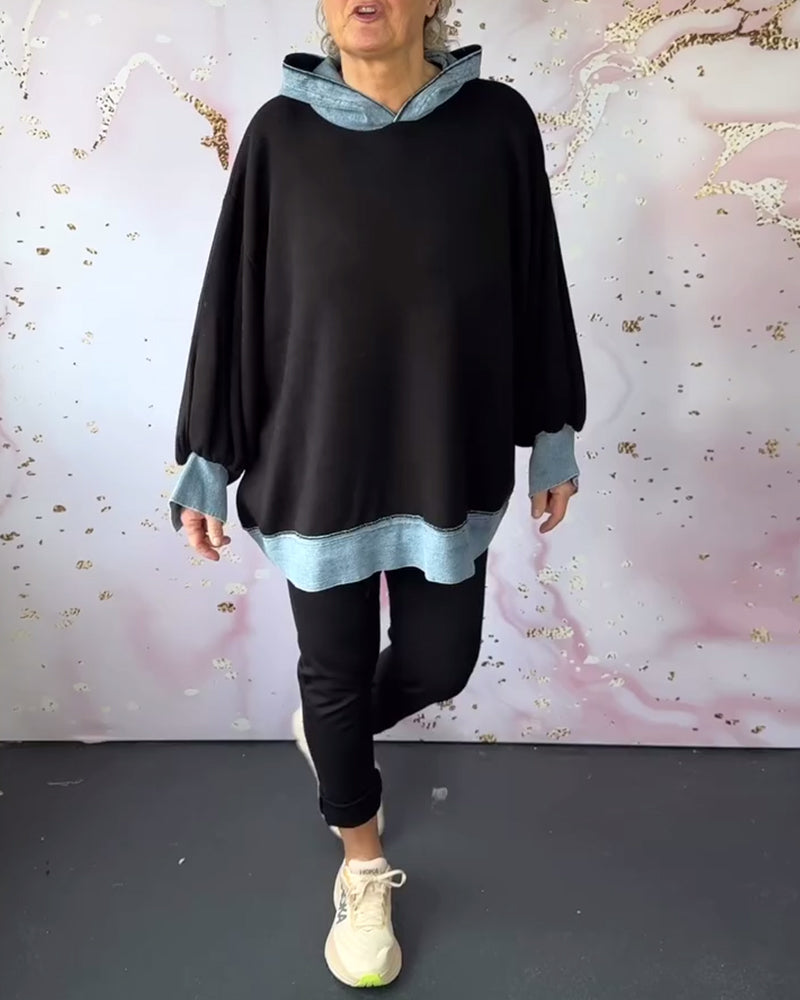 Lässiger kapuzenpullover mit laternenärmeln in kontrastfarbe